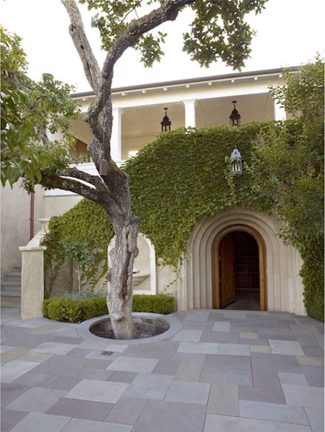 A serene bluestone patio and home designed by Ken Linsteadt Architects; full color bluestone in an ashlar pattern.